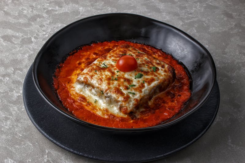 Baked lasagna with rich beef bolognese and bechamel sauce