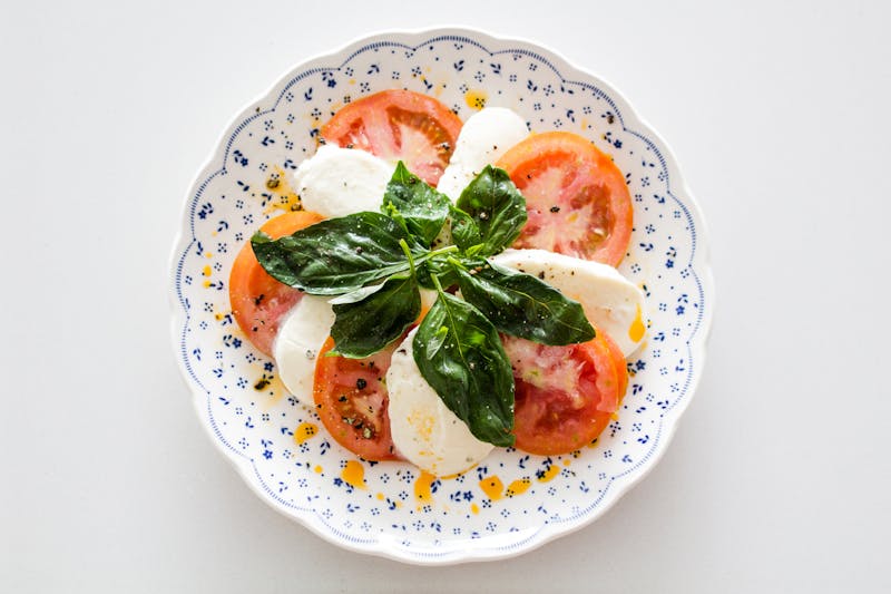 Fresh caprese salad with buffalo mozzarella and heirloom tomatoes